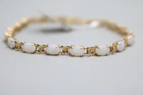 14K Yellow Gold Oval Prong Set Opal Tennis Bracelet (7 Inches)