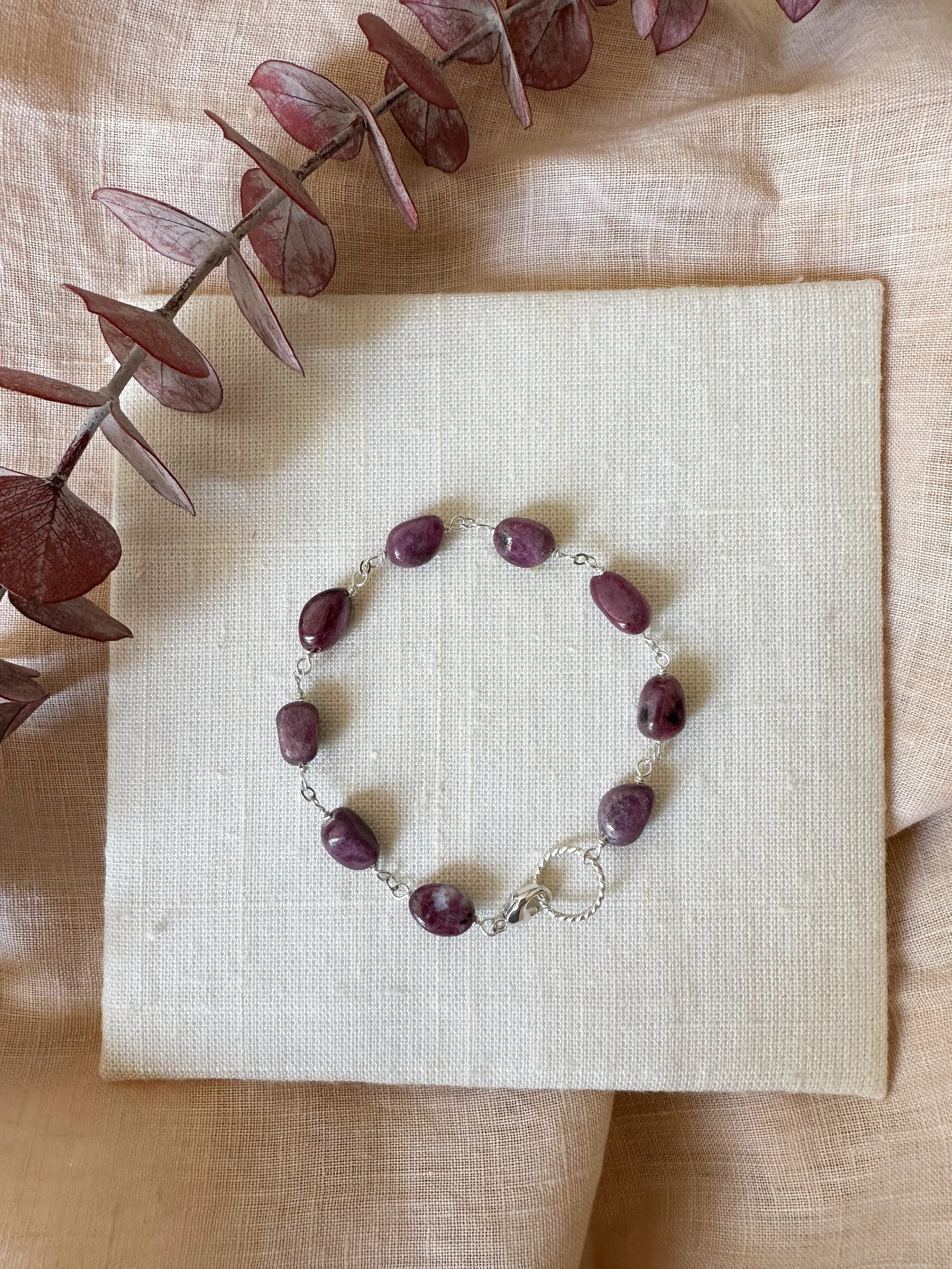 B2309 - sterling silver link bracelet with smooth ruby oval stones