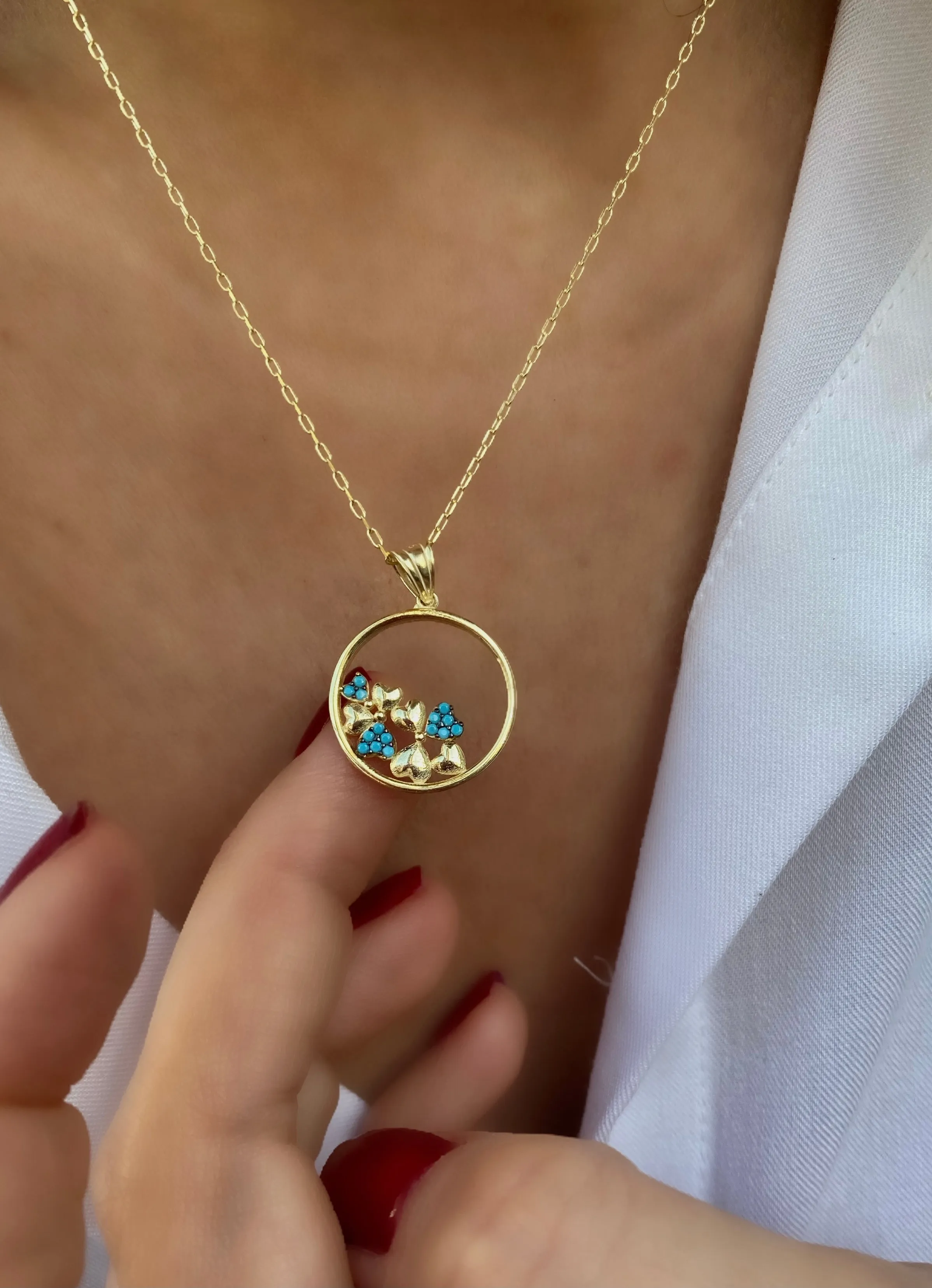 Pendant with turquoise hearts on a circle