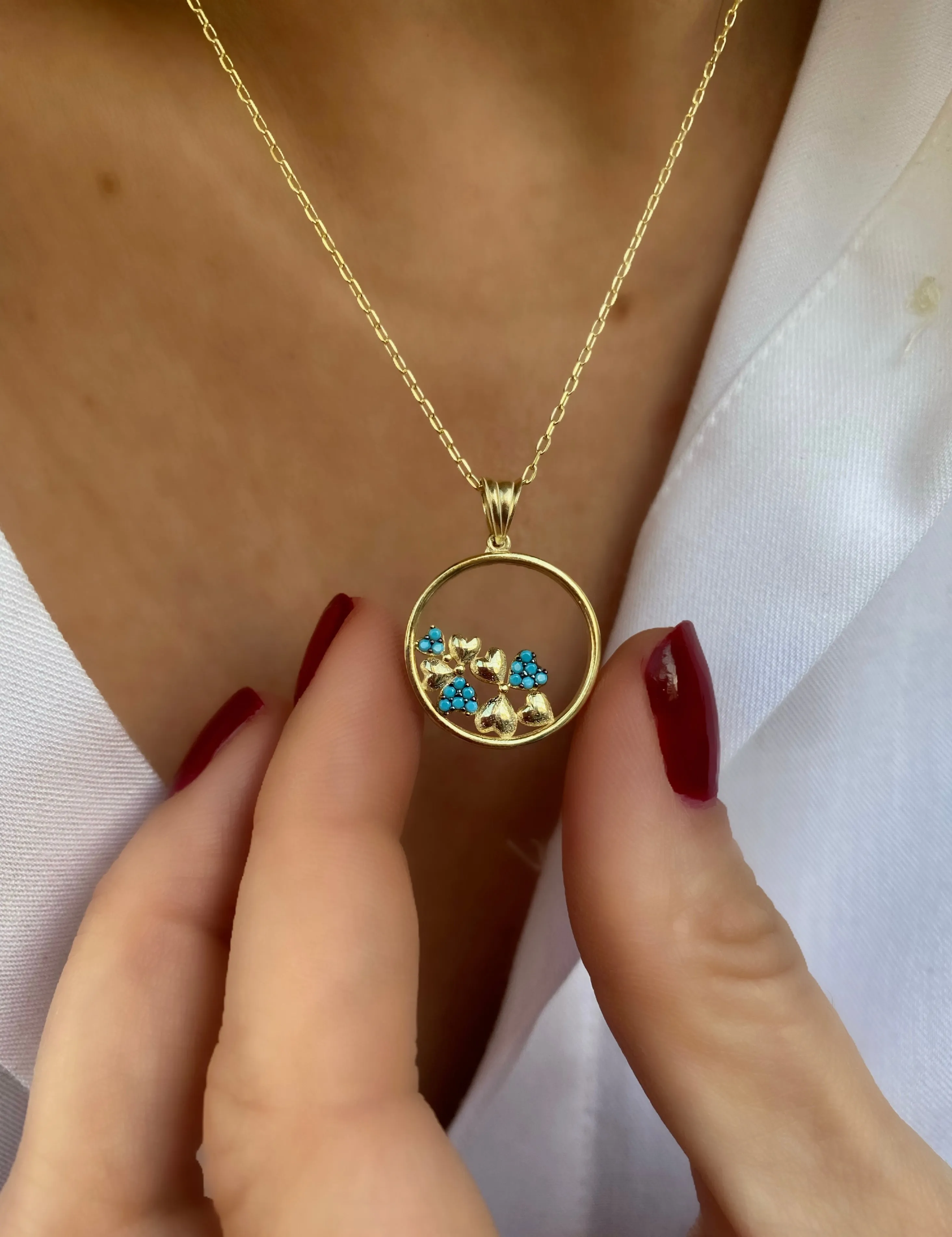 Pendant with turquoise hearts on a circle